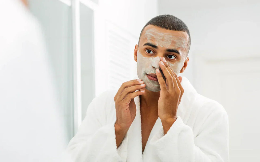 young man following a guide to skincare for men and putting a cleanser in front on the mirror