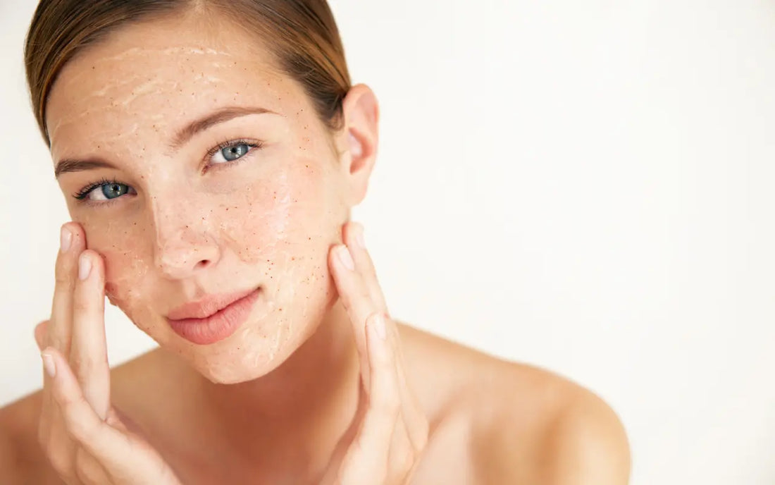 Young girl with wonderful skin demonstrates how to exfoliate like a pro