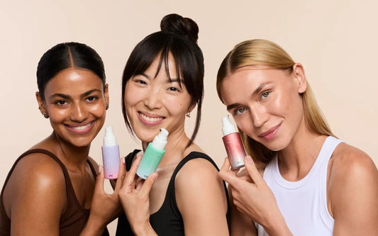 Three women with different skin types holding skincare products, showcasing a diverse skincare routine for every skin type.